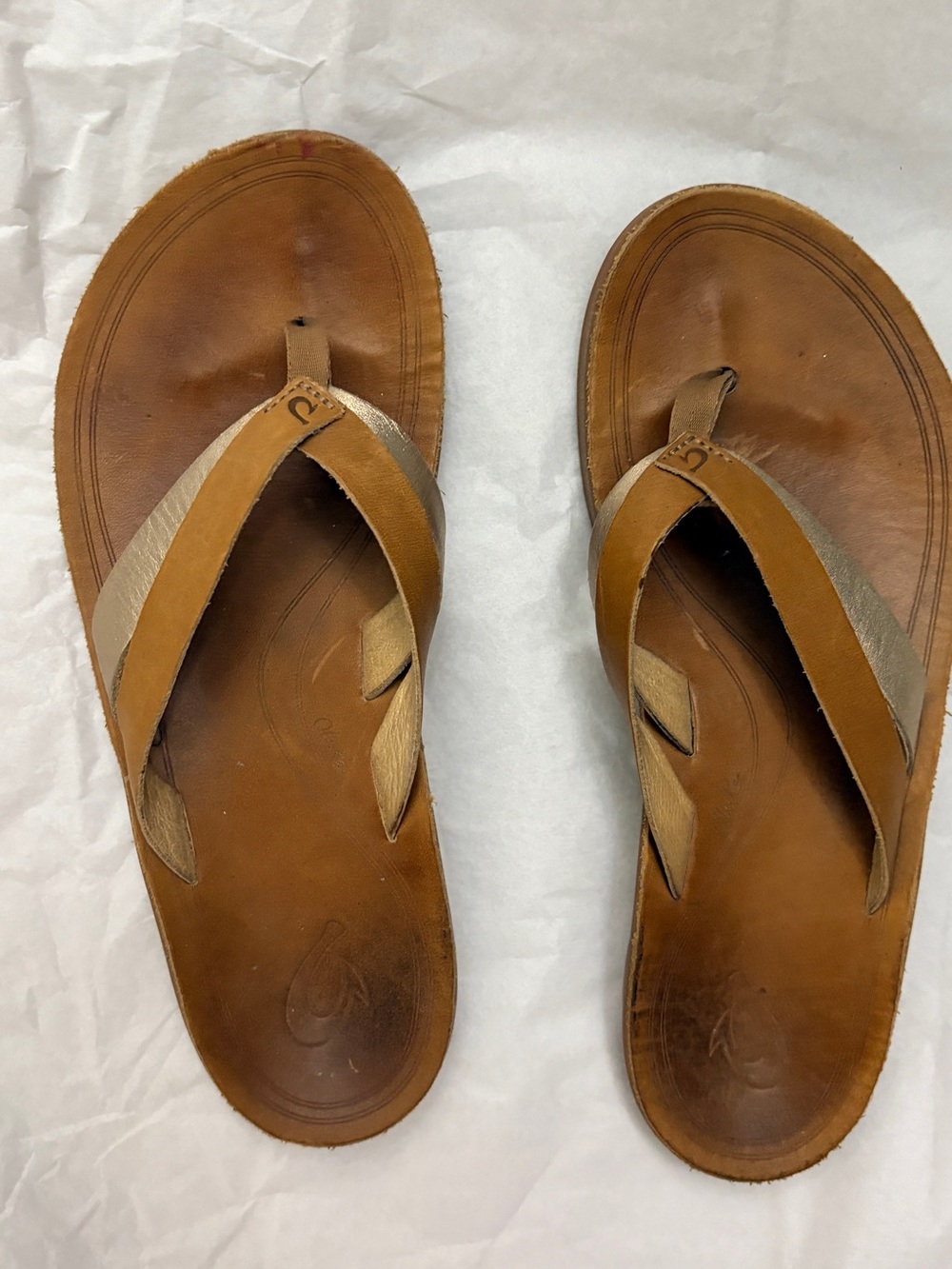 OluKai Women's Tan Leather Flip Sandals with Gold Accent